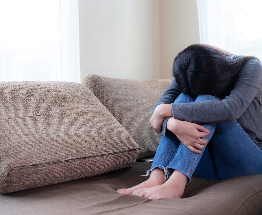 Emotional young woman was depressed on sofa